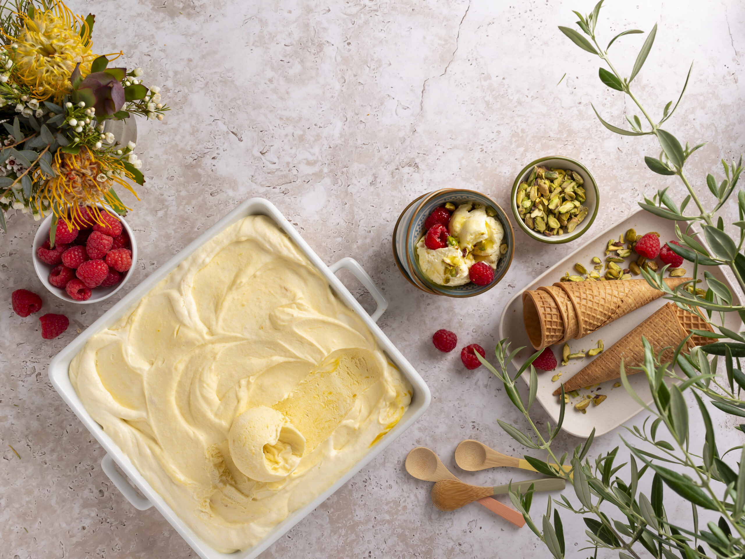 NO-CHURN MANGO ICE CREAM WITH OLIVE OIL, RASPBERRIES & PISTACHIOS